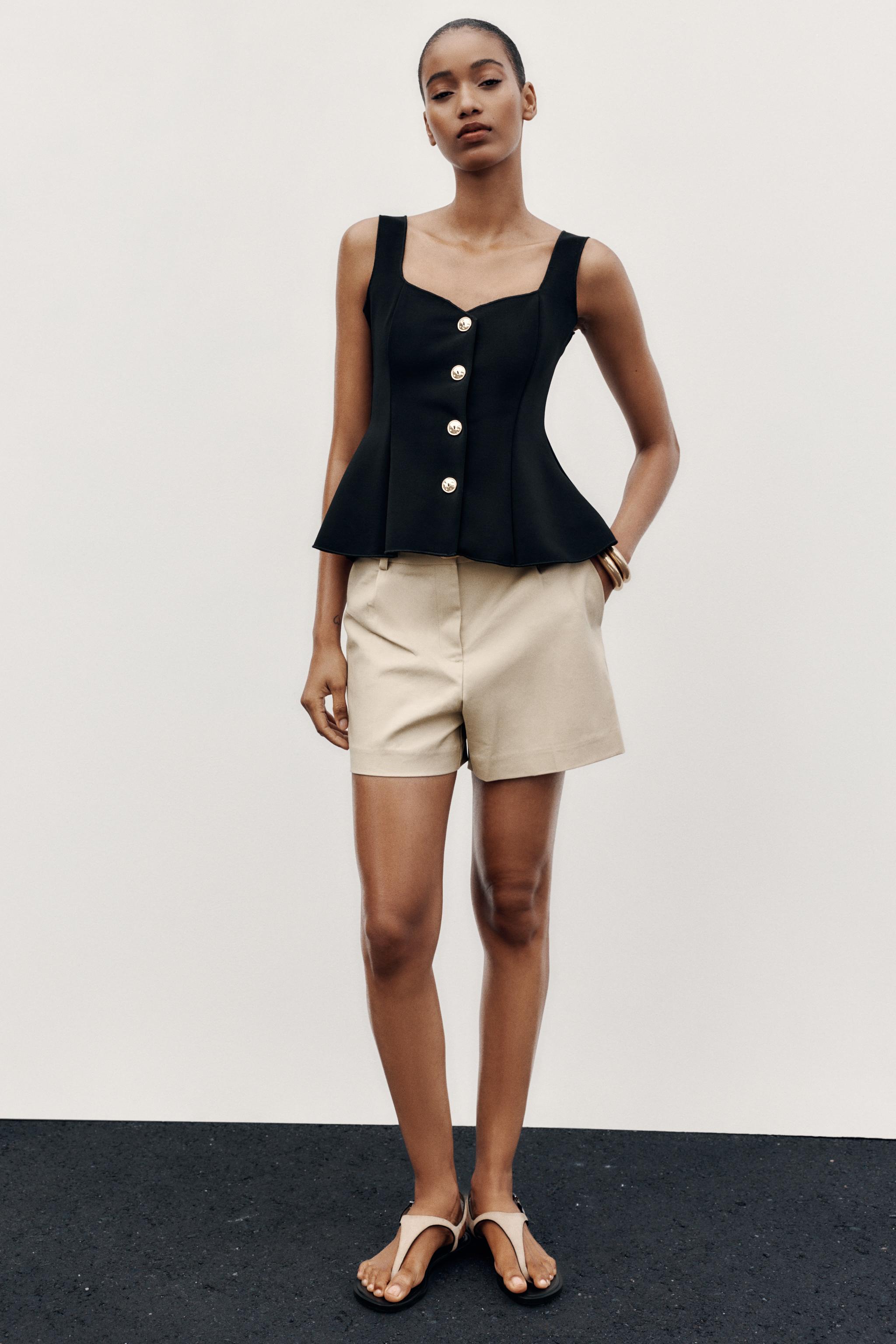 STRETCH PEPLUM VEST TOP